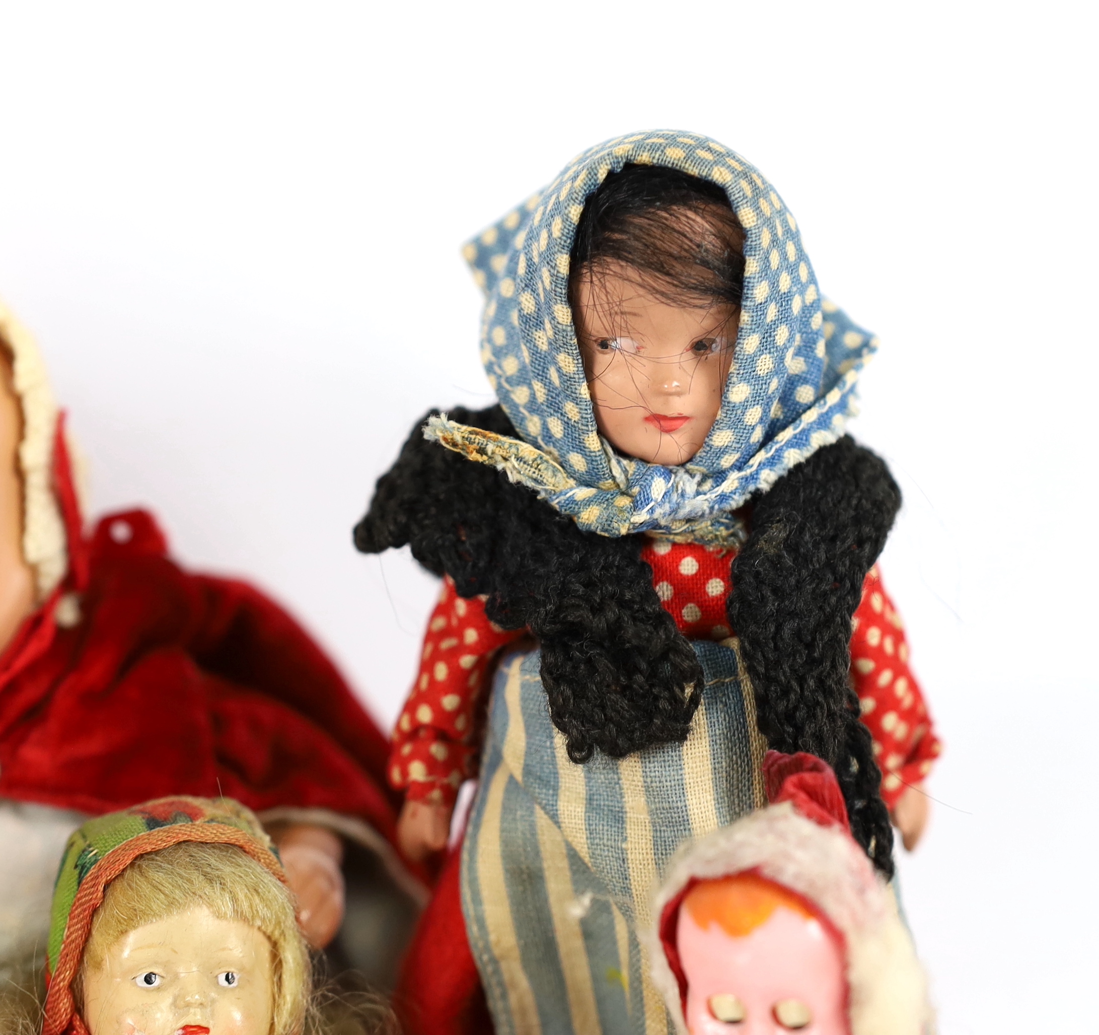 Nine assorted small dolls, mainly composition or plastic